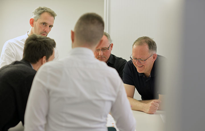 Besprechungssituation mit dem Team